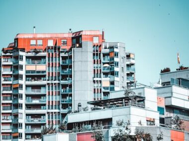 Modern residential buildings in Bern, featuring glass windows and vibrant design.